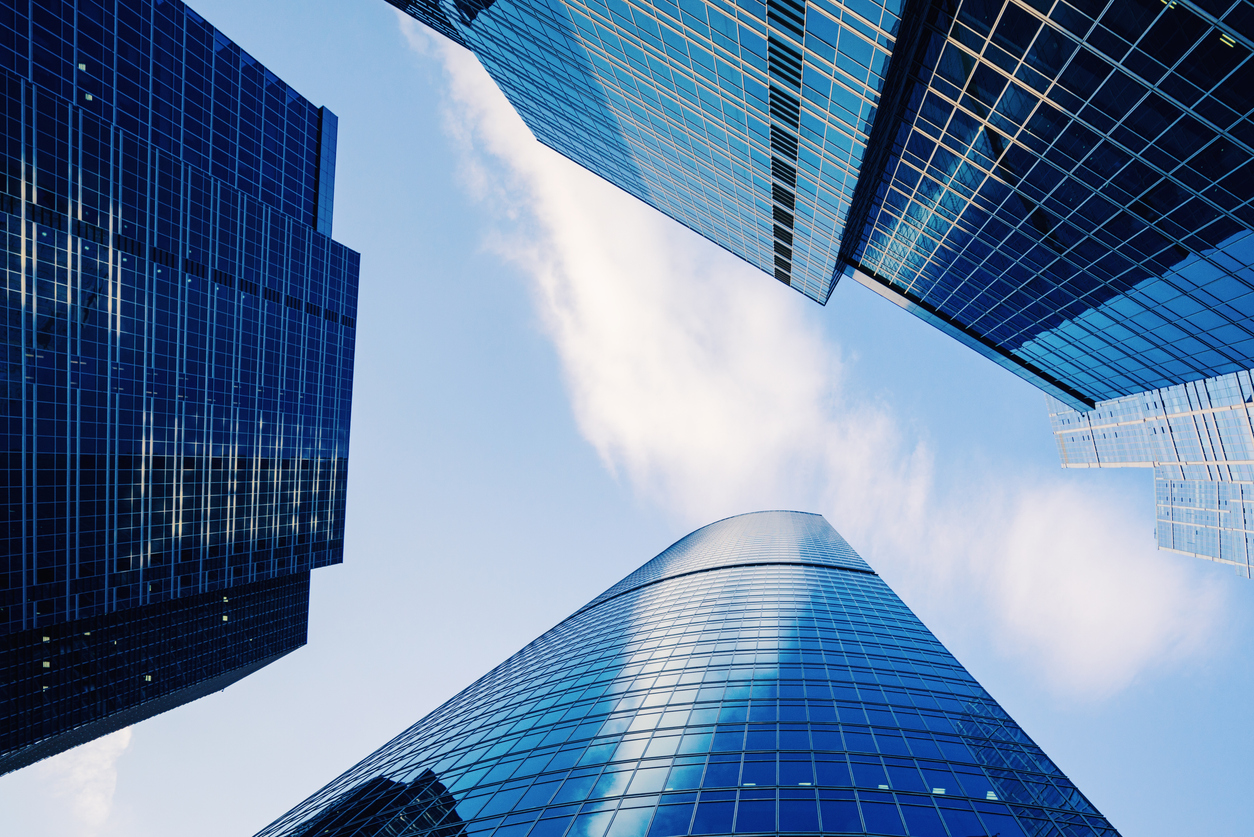 Gleaming glass and steel citadels to commerce stretching into the blue sky above Hong Kong's crowded Central District, China.Gleaming glass and steel citadels to commerce stretching into the blue sky