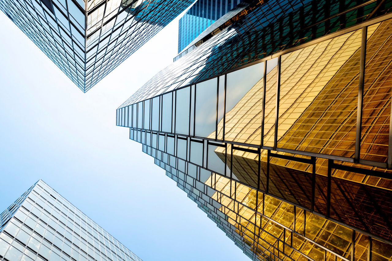 Looking modern office building from below.